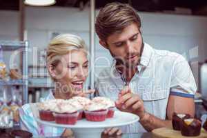 Cute couple on a date choosing cakes