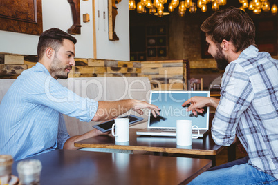 two colleagues working with laptop and tabet