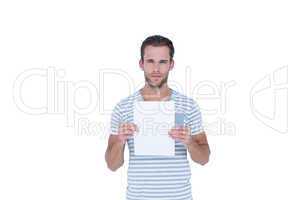 Serious handsome man holding paper