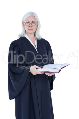 Happy lawyer looking at camera and holding law code