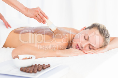 Beautiful blonde enjoying a chocolate beauty treatment