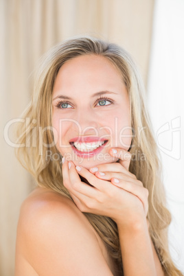 Pretty blonde sitting on massage table