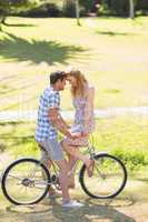 Young couple on a bike ride in the park