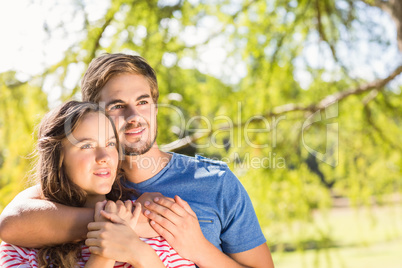 Cute couple hugging in the park