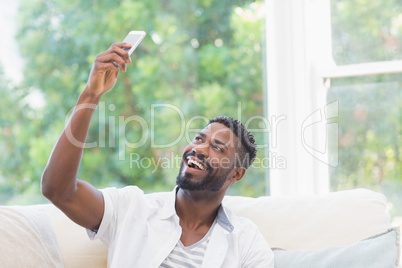 Casual man taking a selfie