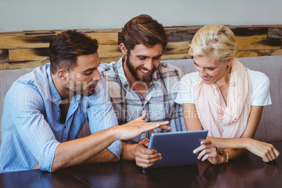 Business team looking at tablet