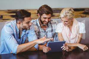 Business team looking at tablet