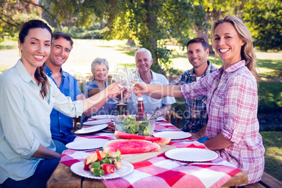 Happy family having picnic in the park