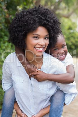 Happy mother and daughter having fun together