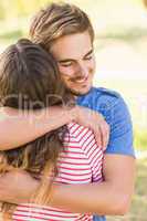 Cute couple hugging in the park