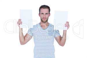 Serious handsome man holding papers