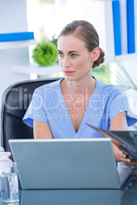 Doctor working on her laptop