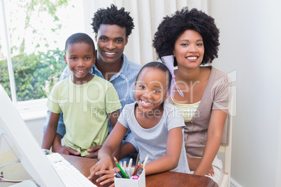 Happy family using the computer