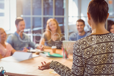 Group of young colleagues using laptop