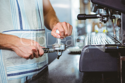 happy worker making coffee