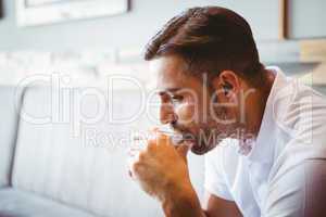 Young man drinking cup of coffee