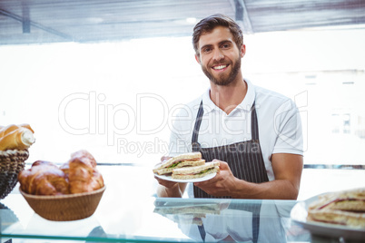 Happy server showing sandwich