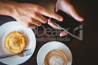 Close up view of pastry and coffee