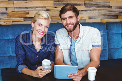 Cute couple on a date looking at the camera