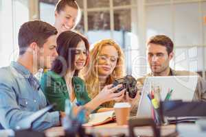 Portrait of smiling casual colleagues using computer