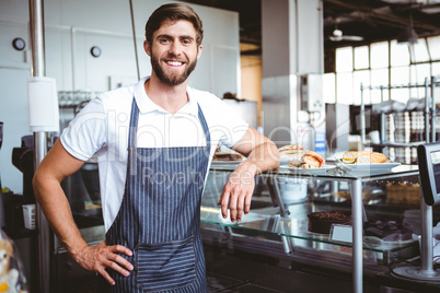 Handsome worker posing on the counter