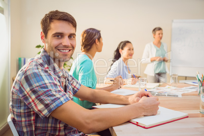 A young designer listening to a conference