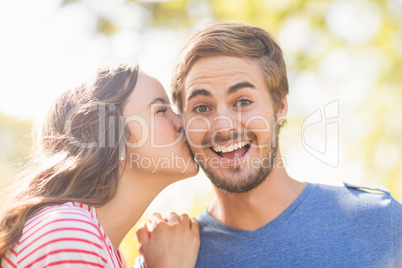 Cute couple kissing in the park