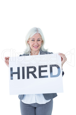 Businesswoman holding sign in front of her