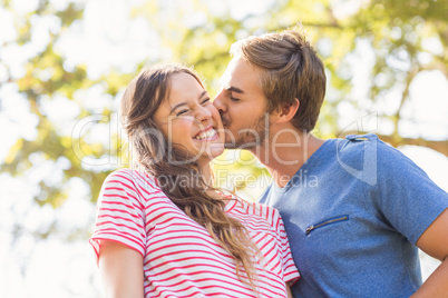 Cute couple kissing in the park