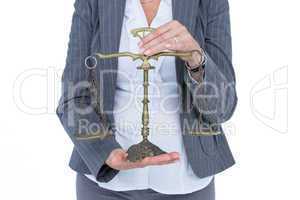 businesswoman holding scales of justice