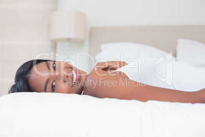 Relaxed woman lying on bed