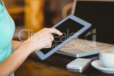 A woman using tablet computer