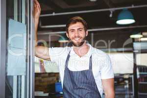 Smiling server in apron