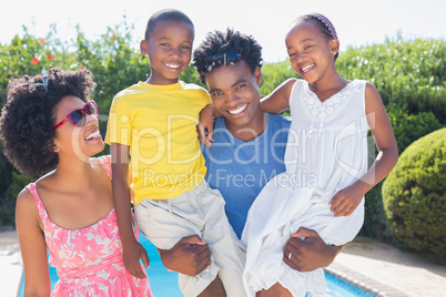 Happy family smiling at camera