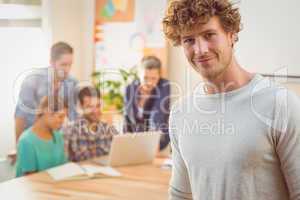 Portrait of a man with his colleague behind him