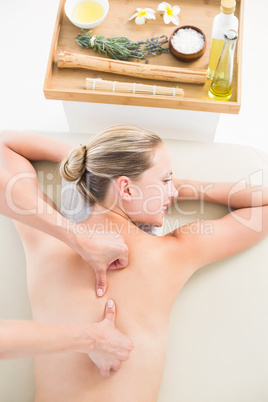 Woman enjoying a back massage