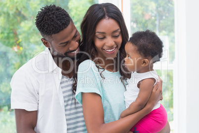 Happy parents with baby girl