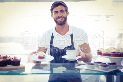 Smiling worker prepares breakfast