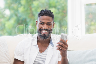 Casual man using his smartphone