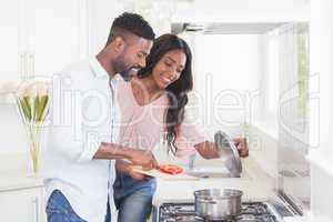 Happy couple cooking food together