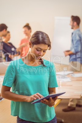 Casual businesswoman using tablet