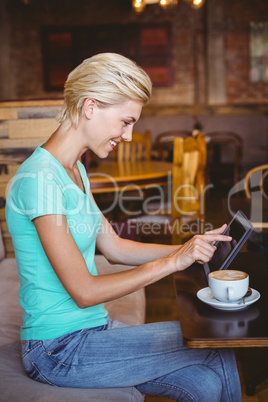 Pretty blonde using tablet computer Pretty blonde using tablet computer