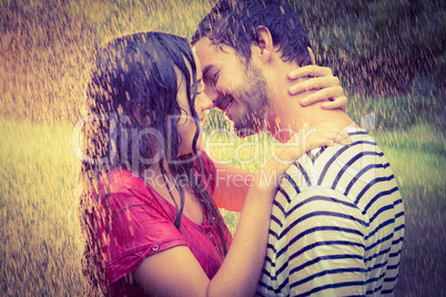 Cute couple hugging under the rain