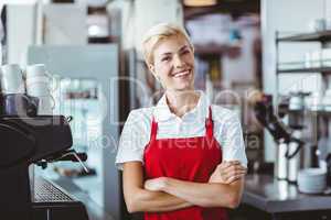 Pretty barista smiling at the camera