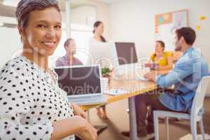 Smiling businesswoman looking at the camera