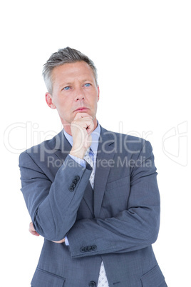 Businessman thinking with hand on chin