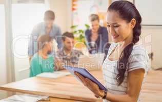 Businesswoman holding a tablet in the office