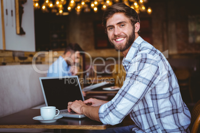 young man working on his computer