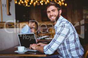 young man working on his computer