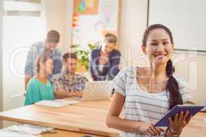 Businesswoman using tablet in the office